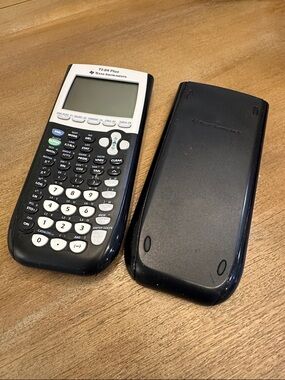 Texas Instruments TI-84 Graphing Calculator in Black and White NO BATTERIES